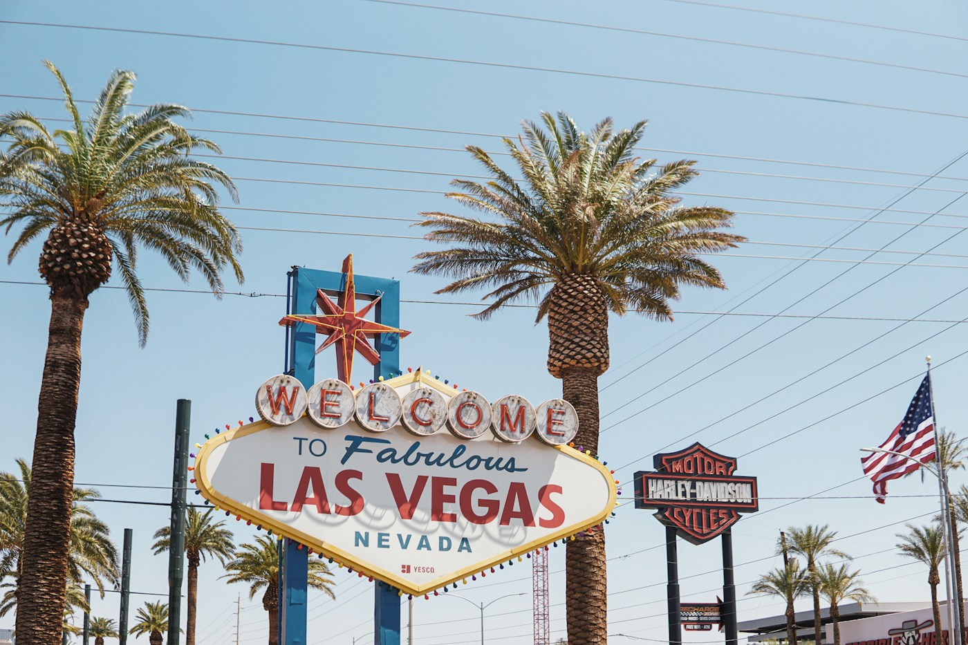 The Las Vegas welcome sign framed by palm trees